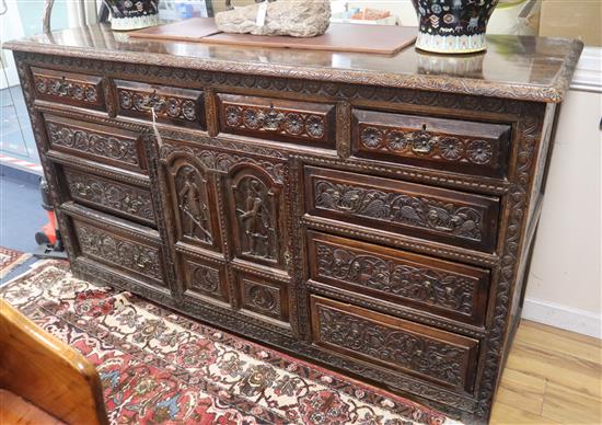 An 18th century later carved oak dresser W.190cm